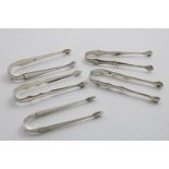 FIVE VARIOUS PAIRS OF GEORGE III SUGAR TONGS (three pairs with initials), mixed makers and dates;