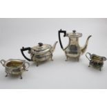 A GEORGE V FOUR-PIECE TEA & COFFEE SERVICE with plain rounded bodies, gadroon & shell bordrs and