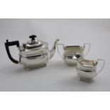 A GEORGE V THREE-PIECE TEA SET of shaped rectangular outline with angular handles, reeded rims and