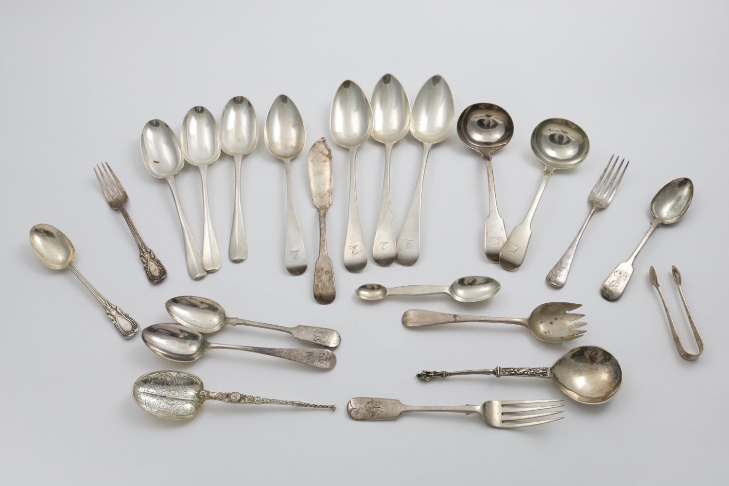 A MIXED LOT OF FLATWARE:- A pair of George IV Fiddle pattern sauce ladles, seven table spoons, a