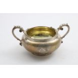 A WILLIAM IV TWO-HANDLED SUGAR BOWL with a squat circular body, engraved on one side with a coat