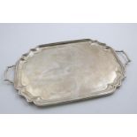 A GEORGE V (GREAT WAR PERIOD) TWO-HANDLED TEA TRAY of shaped rectangular outline with a moulded