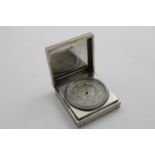 AN EDWARD VIII POCKET ANEROID BAROMETER AND THERMOMETER COMBINED in a square, engine-turned case