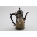 A GEORGE II COFFEE POT with a tapering body, tucked-in base and spreading foot, the domed cover with