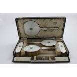 AN EDWARD VIII ART DECO DRESSING TABLE SET decorated with pearlescent enamel and carved jadeite