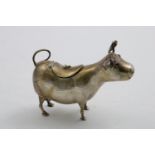 A CONTINENTAL COW CREAMER with curly horns and red hardstone eyes, with English import marks for