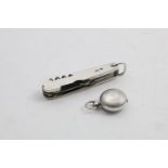 A LATE VICTORIAN MOUNTED, POLISHED STEEL POCKET KNIFE & MULTI-TOOL with plain pellets and suspensory