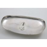 AN ELIZABETH II HANDMADE DISH of shallow rounded oblong form on a circular collet foot, the centre