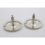 A PAIR OF ELIZABETH II ASH TRAYS each centred by a cast regimental figure, by Garrard & Co.,