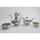 A VICTORIAN FOUR-PIECE TEA AND COFFEE SERVICE Middle Eastern in style with chased formal