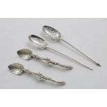 A GEORGE II MOTE SPOON by Elias Cachart, another with maker's mark "I.I" crowned? and a pair of