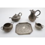 AN EARLY 20TH CENTURY INDIAN SQUAT CIRCULAR TEA POT, SUGAR BOWL, CREAMS JUG & BALUSTER HOT WATER JUG