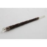 A CONTEMPORARY MOUNTED HARDWOOD AND ROCK CRYSTAL WAND OR POINTER with cabochon-set garnets,