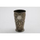 ROWING / SCULLING PRIZE:- A late Victorian tapering beaker with formal reousse-work decoration and