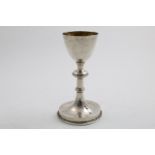 A LATE 18TH CENTURY CONTINENTAL CHALICE with a knopped stem and a beaded, circular foot (lacking a