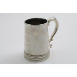 A 19TH CENTURY CHINESE MUG of tapering form with a reeded foot, a scroll handle and inset glass