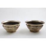 A PAIR OF EARLY 20TH CENTURY DANISH BOWLS with a hammered finish, slightly everting rims,