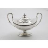 A LATE VICTORIAN PART-FLUTED SAUCE TUREEN AND COVER with loop handles and an oval pedestal foot,