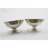 A PAIR OF GEORGE III SCOTTISH SALTS on shaped pedestal bases, with gilt interiors, by W & P.