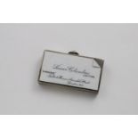 A LATE VICTORIAN VESTA CASE enamelled on the front in monochrome to resemble a calling card with