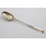 A GEORGE II IRISH HANOVERIAN PATTERN BASTING OR SERVING SPOON with a pronounced rib and a single