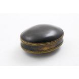 AN EARLY 18TH CENTURY GILT-METAL MOUNTED TORTOISESHELL TOBACCO BOX oval with fine lappet borders and