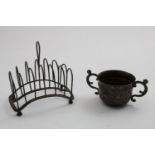 A GEORGE III ARCHED TOAST RACK on four paw feet, by Samuel Whitford, London 1790 and a small late