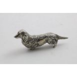 AN ELIZABETH II CAST FIGURE OF A DACHSHUND by Garrard & Co.Ltd., London 1978; 5.7" (14.4 cms)