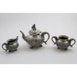 AN EARLY 20TH CENTURY INDIAN THREE-PIECE EXHIBITION QUALITY "SWAMI" TEA SET on an elephant theme