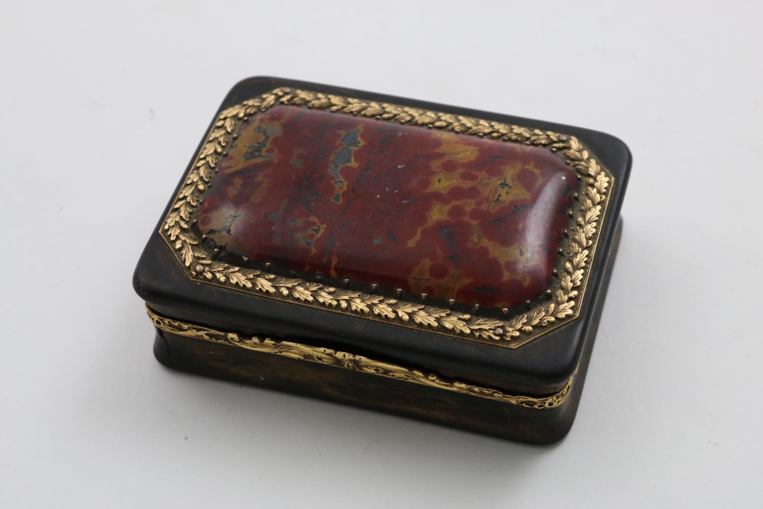 A GEORGE III GOLD MOUNTED TORTOISESHELL SNUFF BOX rectangular with chased borders, the cover set