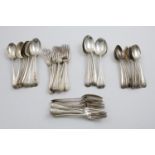A GEORGE V PART-SERVICE OF OLD ENGLISH PATTERN FLATWARE:- Twelve table spoons, six slightly larger