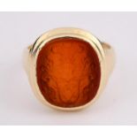 A GOLD SIGNET RING the intaglio sardonyx stone engraved with a coat of arms, probably Continental