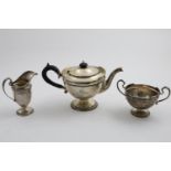 A GEORGE V THREE-PIECE CIRCULAR TEA SET with shaped, moulded rims, gadrooned borders and pedestal