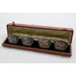 A CASED SET OF FOUR EARLY 20TH CENTURY FRENCH MENU CARD HOLDERS with spring clips, each inset with a