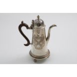 A GEORGE V IRISH COFFEE POT AND STAND in the style of a George I example with engraved cypher on one