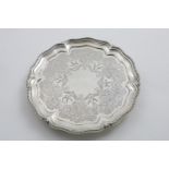 A LATE VICTORIAN ENGRAVED SALVER of shaped circular outline with garlands of flowers & birds, a bead