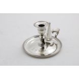 A GEORGE III / IV CIRCULAR CHAMBERSTICK with reeded borders, detachable nozzle and non-matching