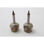 A PAIR OF ENAMEL FLASKS AND STOPPERS of bottle shape, the bodies each with three reserved