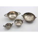 THREE VARIOUS SOUTH AMERICAN SMALL TWO-HANDLED CUPS OR DISHES and another with a single handle;