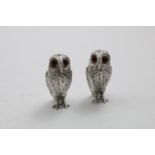 A PAIR OF ELIZABETH II CAST OWL CONDIMENTS (one for salt; one for pepper), with glass eyes, by