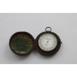 A VICTORIAN POCKET ANEROID BAROMETER resembling a pocket watch with engine-turned decoration on