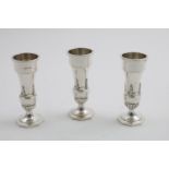 A SET OF THREE ELIZABETH II ART DECO REVIVAL VASES by Walker & Hall, Sheffield 1964; 4.9" (12.5 cms)