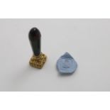 AN EARLY VICTORIAN GOLD-MOUNTED BLOODSTONE SEAL with a faceted stem and a chased seal with