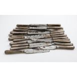 A SET OF THIRTY ONE GEORGE IV TABLE KNIVES with Fiddle & Thread pattern handles, crested, and