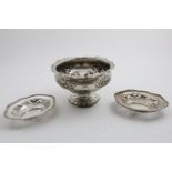 A LATE VICTORIAN EMBOSSED ROSE BOWL with a shaped rim and four vacant cartouches around the sides,
