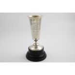 AN EDWARDIAN TROPHY CUP on a domed foot with a beaker-shaped bowl and an inscription relating to the