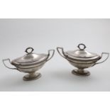 PAUL STORR:- A pair of George III two-handled sauce tureens and covers on oval pedestal bases with