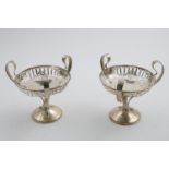 A PAIR OF GEORGE V PEDESTAL BONBON DISHES with three loop handles and pierced bowls, by Joseph