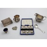 A MIXED LOT:- A small cigarette box, inscribed, a cased set of six coffee spoons, a mug,