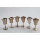 A SET OF SIX ELIZABETH II GOBLETS on domed pedestal bases with flared bowls, by Joseph Gloster Ltd.,